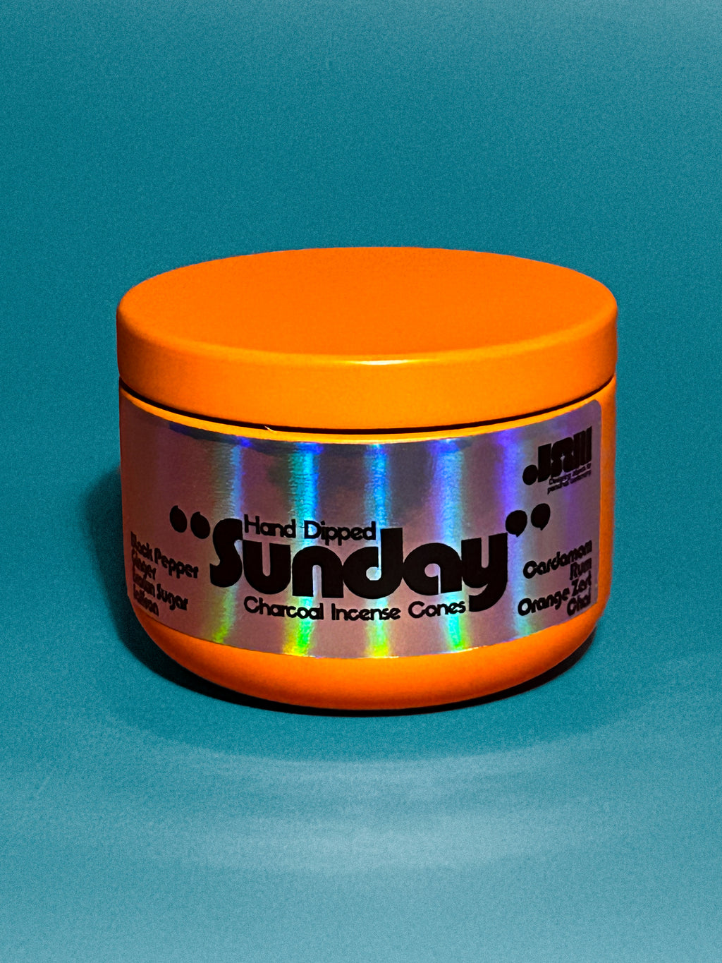 Orange container with 'Sunday' scent hand dipped charcoal incense cones branding on a blue background