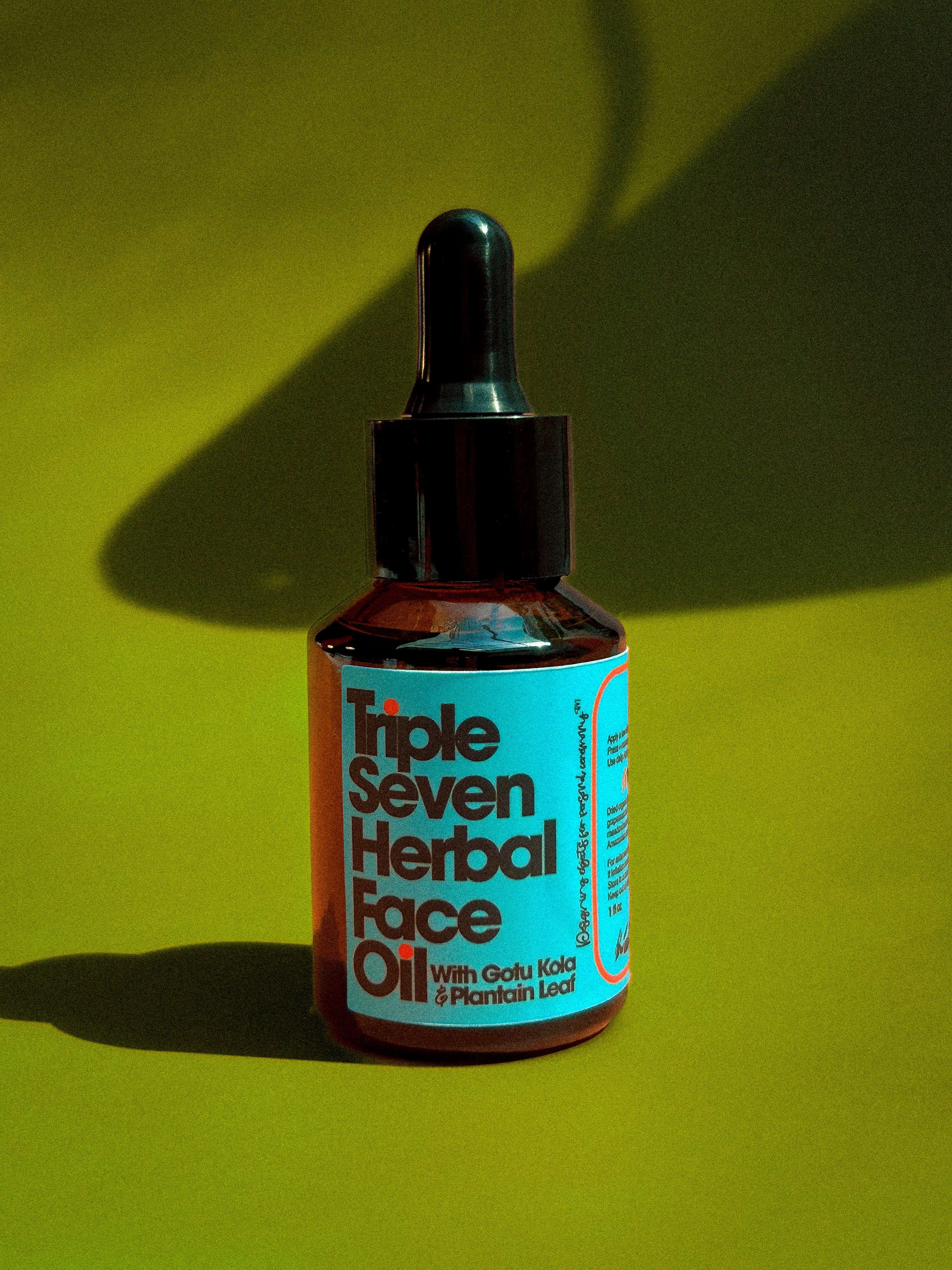 Bottle of Triple Seven Herbal Face Oil on a green retro color grading background