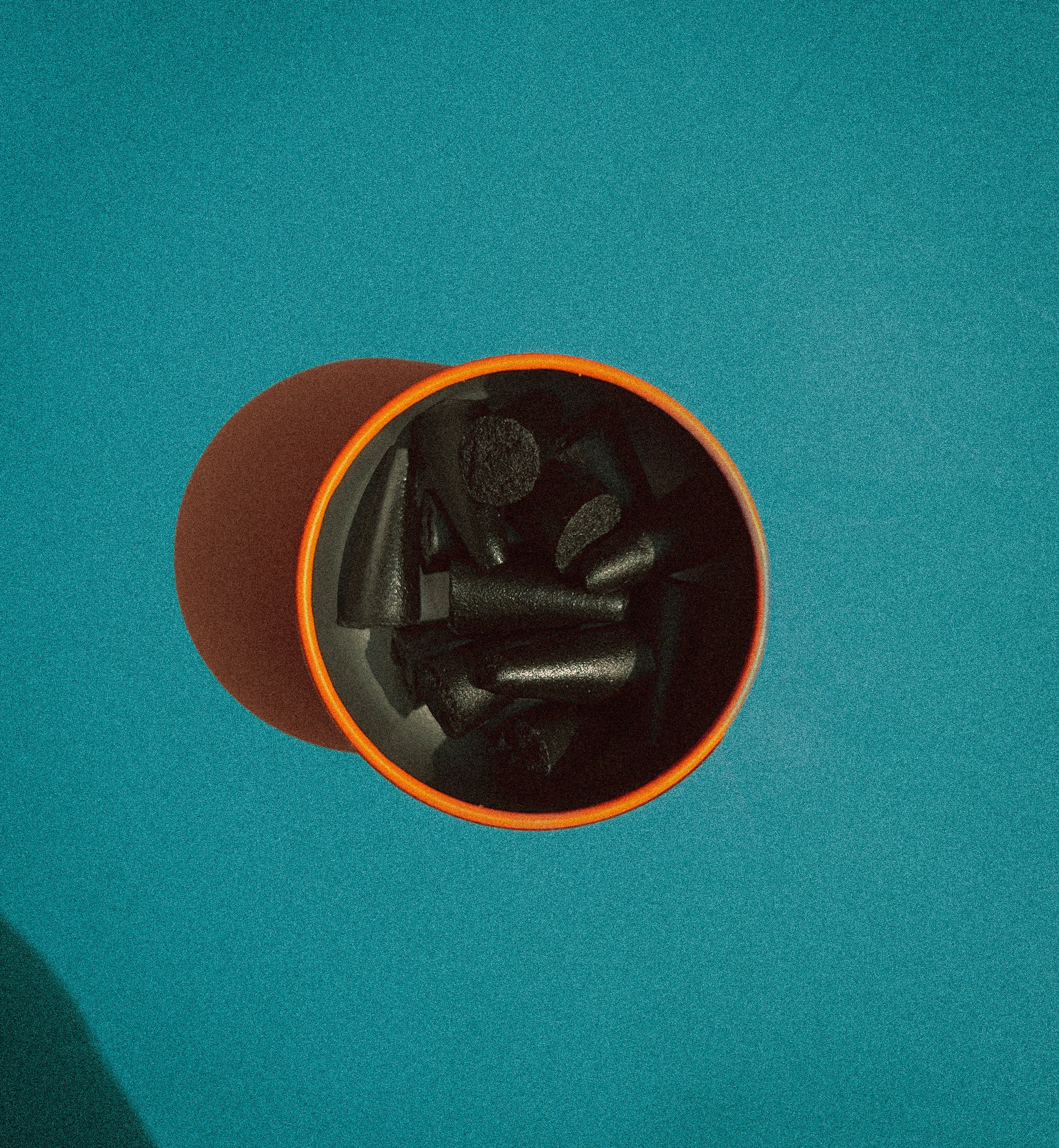overhead photo shot with 'Sunday' scented hand dipped charcoal incense cones branding on a blue background.