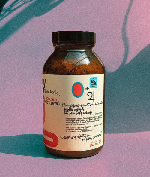 Honey Noon bottle with label on a gradient background